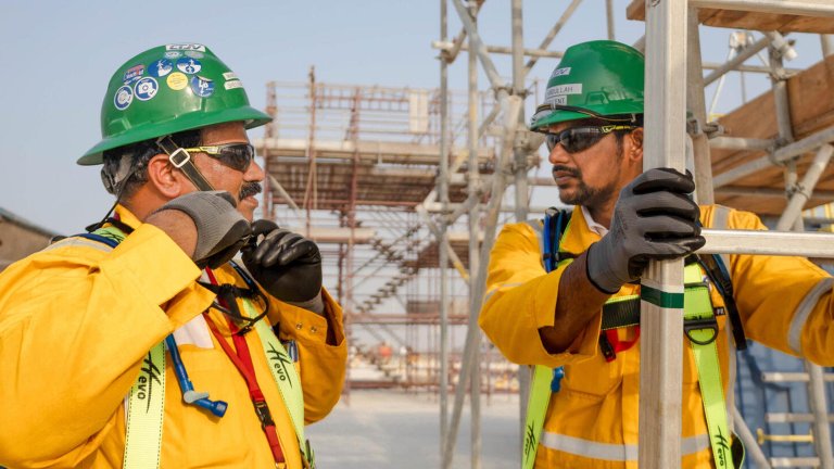 Image of two Technip Energies men working on construction site