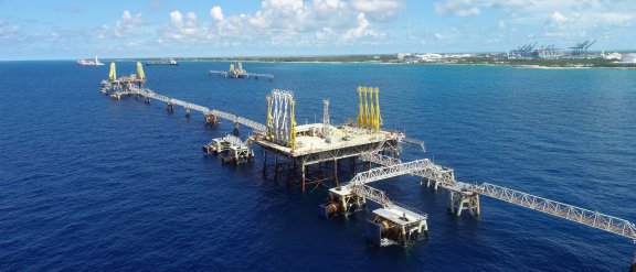 Two boats loading and unloading energy on the open sea