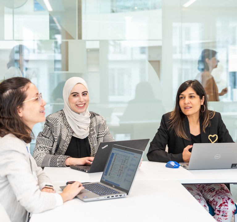 Three Technip Energies employees sitting in a boardroom